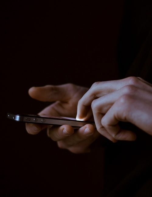 photo of hands holding a mobile phone photo of hands holding a mobile phone